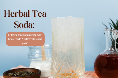 Herbal tea soda in a glass surrounded by the ingredients 