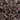 Close-up of loose Organic Pu-erh tea leaves showcasing dark, twisted leaves with a rich earthy texture.