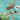Assortment of loose Organic Live Fit Tea ingredients displayed in wooden spoons on a turquoise tile surface, featuring herbs, dried fruits, and roots.