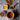 Cup of Organic Antioxidant Boost Tea with turmeric, cacao nibs, black pepper, cinnamon sticks, and loose tea ingredients on a textured gray surface.