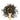 A wooden spoon with ceylon green herbs spread on it and around it. 