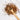 Wooden spoon of Organic Cold Remedy loose leaf tea on a white background.