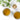 Two cups of tea with a small container of herbs on a white surface.