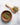 Spearmint herbs in a wooden spoon and bowl on a light gray background