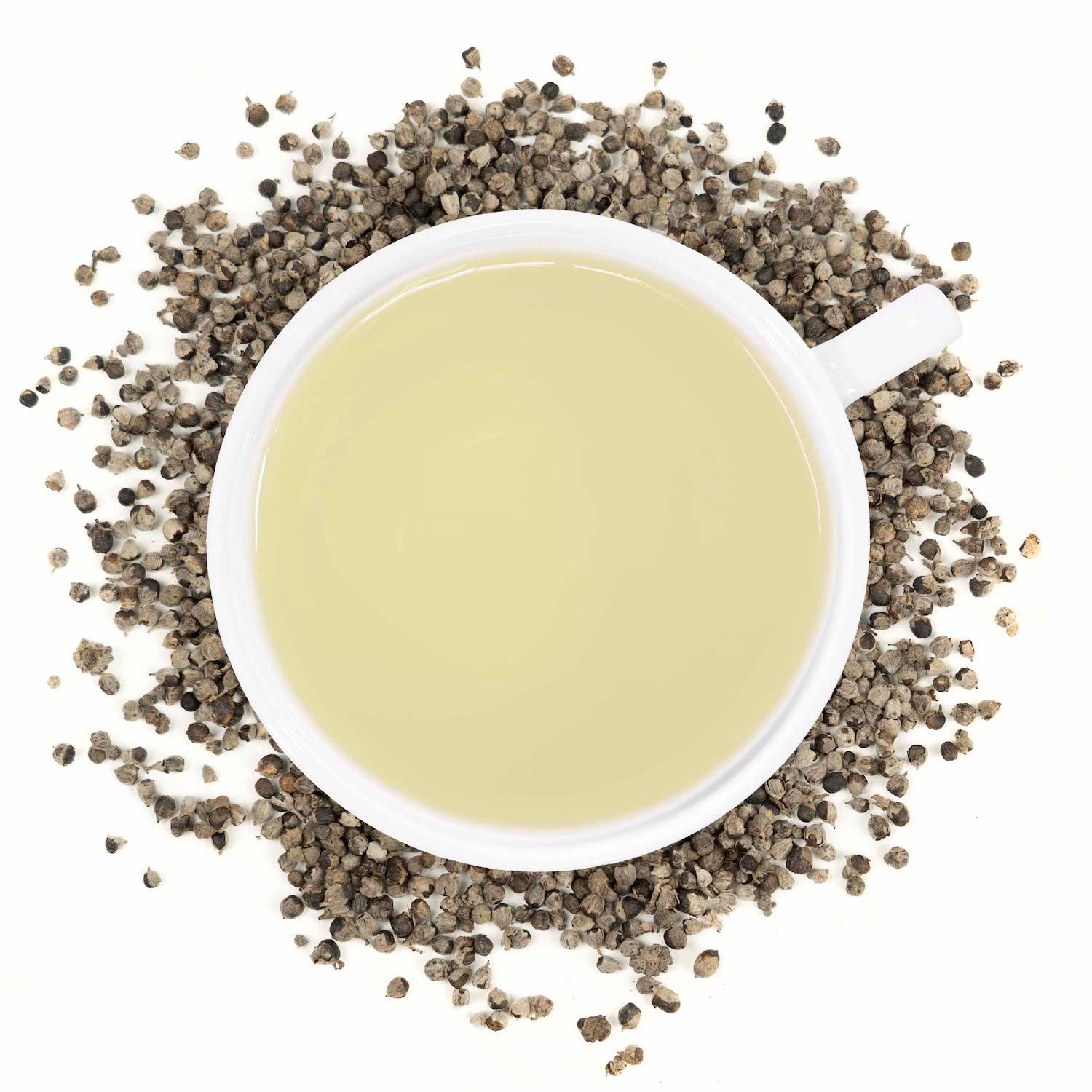 A white mug filled with vitex berry tea surrounded by vitex berries. 