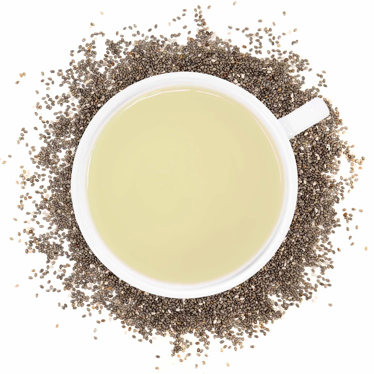 A white mug filled with chia seed tea surrounded by chia seeds. 