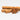Three cinnamon sticks and a star anise on a white background