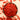 Black bowl filled with red goji berries on a light background