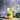 A tall glass of iced Organic Recovery Tea garnished with mint leaves and a lime slice, served with a bamboo straw, on a rustic surface with fresh mint in the background.