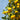 Yellow lemons hanging from a tree with a clear blue sky background