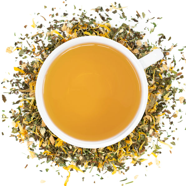 A white cup of Organic Lymphatic Cleanse tea surrounded by the loose leaf blend.
