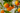 Oranges hanging from a tree with a blurred background