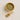 Wooden bowl and scoop filled with green leaves on a beige background